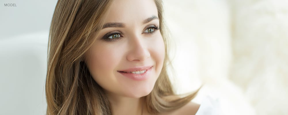 Headshot of Smiling Woman Looking Away from the camera