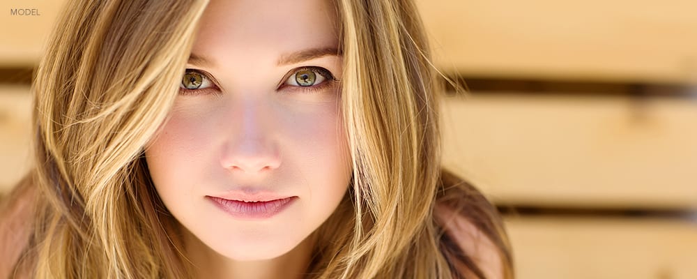 Headshot of Young Blonde Woman with Intense Stare